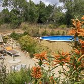 swimming pool surrounded by gardens | Quinta Maragota Eastern Algarve